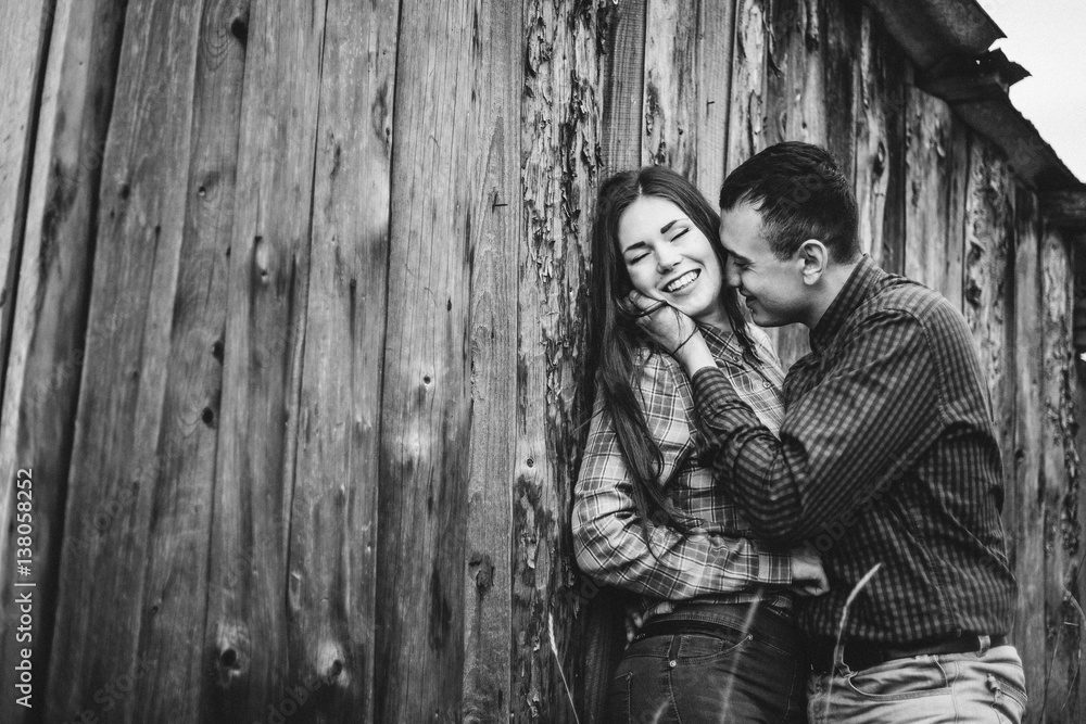 Beautiful loving couple in hipster fashion style posing on mountain