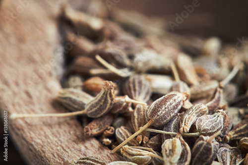Close-up of dried anise seed (aniseed) in wooden bowl