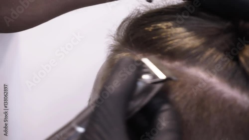 Men's hairstyling and haircutting in a barber shop or hair salon.