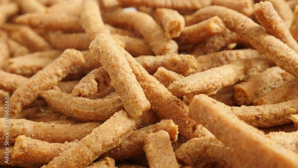 Panning on grissini snack made of dough with chilli 4K 2160p 30fps UltraHD footage - Close-up of tasty integral breadsticks fried in oil slow pan 3840X2160 UHD video Panning on grissini snack made of dough with chilli 4K 2160p 30fps UltraHD footage - Close-up of tasty integral breadsticks fried in oil slow pan 3840X2160 UHD video