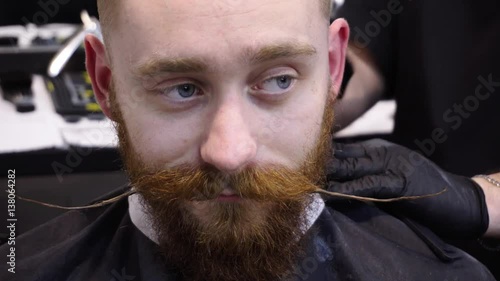 Men's hairstyling and haircutting in a barber shop or hair salon.