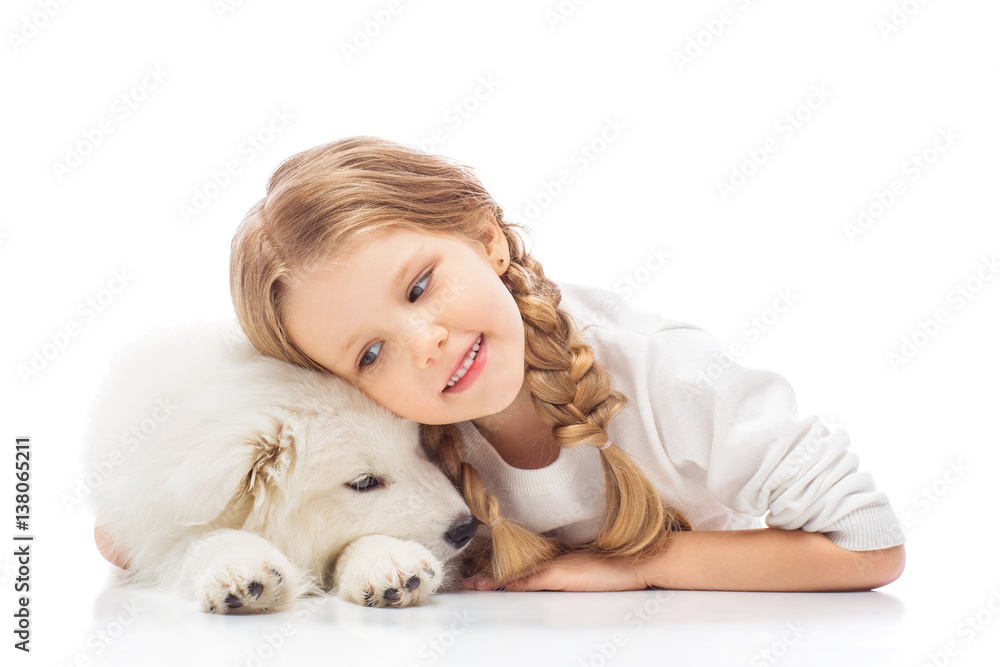 Little girl with a samoyed puppy Little girl with a samoyed puppy