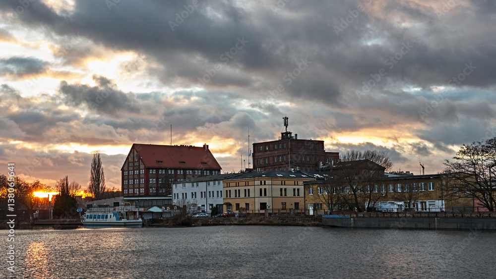 The old town on the river at sunset.