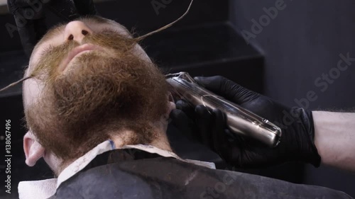 Men's hairstyling and haircutting in a barber shop or hair salon.