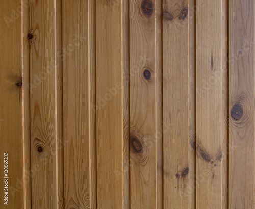Wooden wall paneling under the varnish, vertical, big.