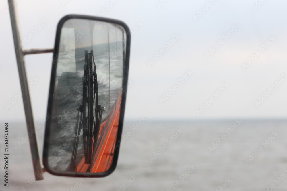 Rearview Mirror in the cockpit with the pilot boat reflection mechanical brushes and seawater