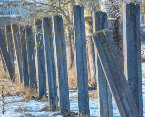 concrete posts with snow in the winter.