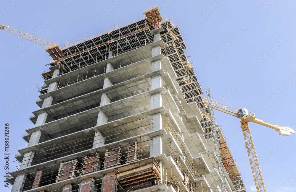 Building of large modern apartment scraper on the construction site