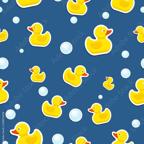 Rubber duck and bubbles seamless pattern bath toy on blue background. Vector illustration