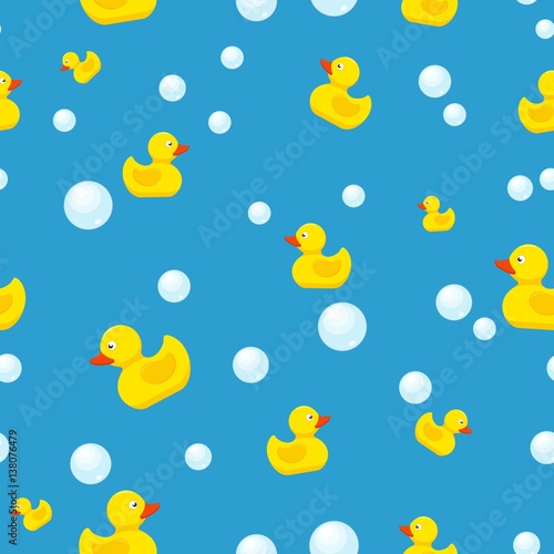 Rubber duck and bubbles seamless pattern bath toy on blue background. Vector illustration