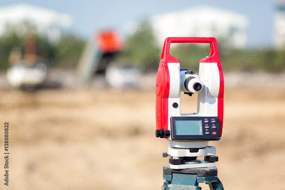 Surveyor equipment tacheometer or theodolite outdoors at construction site for civil engineer checking the construction area Surveyor equipment tacheometer or theodolite outdoors at construction site for civil engineer checking the construction area