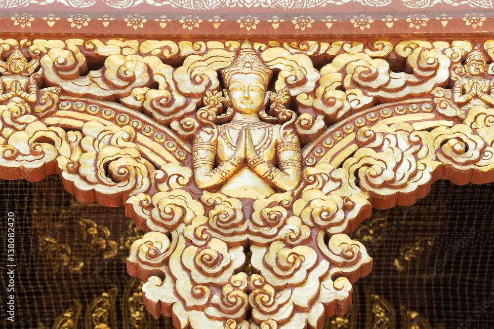 Golden stucco of the angle in Thai temple.