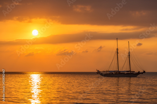 Yacht in the sea at sunset