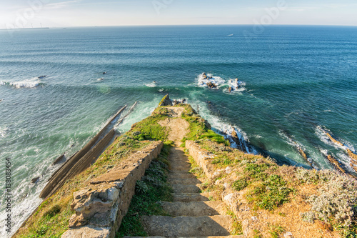 stairs lookout to cantabrian sea, located at basque country. Spain photo