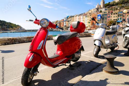 Red Vespa in the city photo