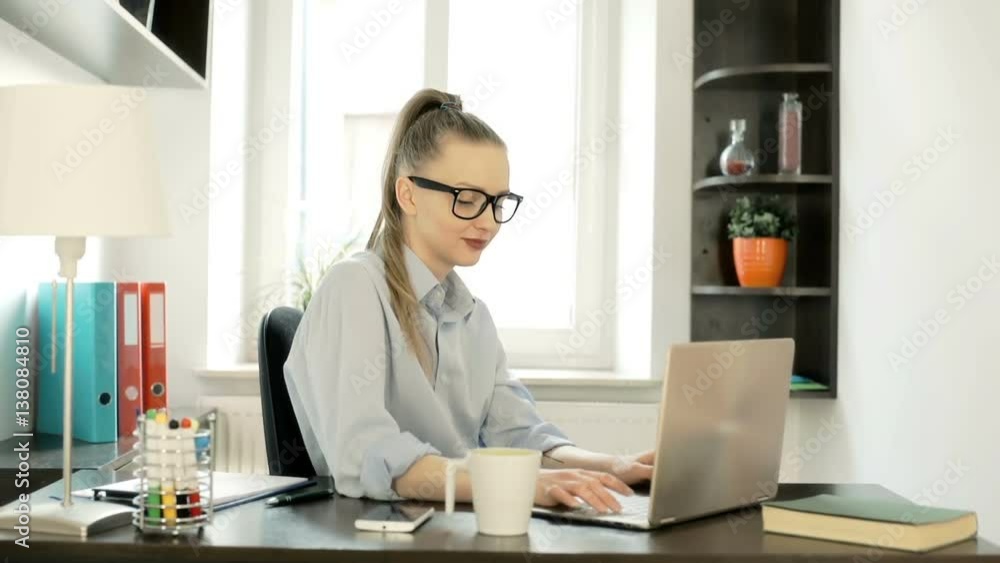 Beautiful businesswoman finishes working on laptop and drinking coffee, steadycam shot
Beautiful businesswoman finishes working on laptop and drinking coffee, steadycam shot