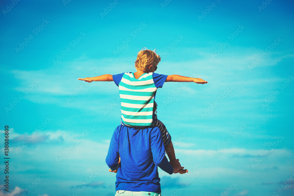 father and son having fun on sky father and son having fun on sky