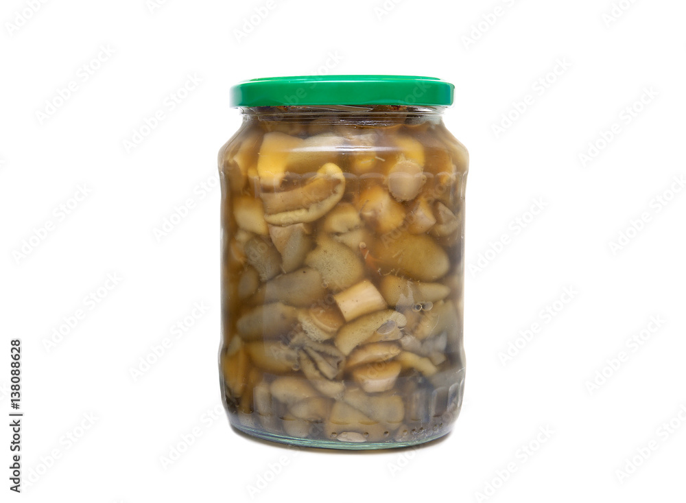 marinated mushrooms in the glass jars on white background marinated mushrooms in the glass jars on white background