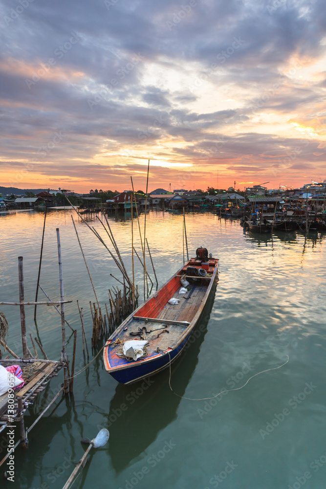 Fototapeta premium fishing boats at fisherman village with nice sky