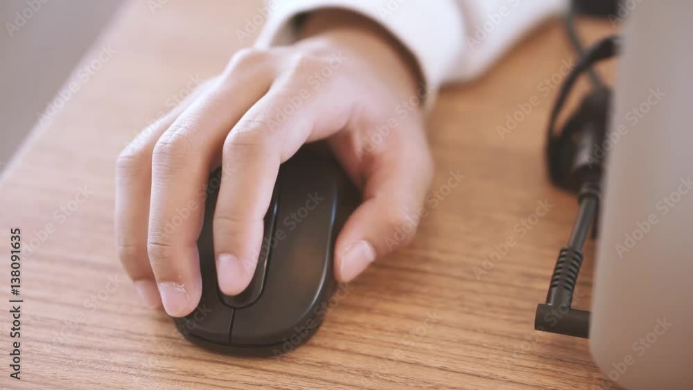 Hand using computer wireless mouse in film tone style
Hand using computer wireless mouse in film tone style