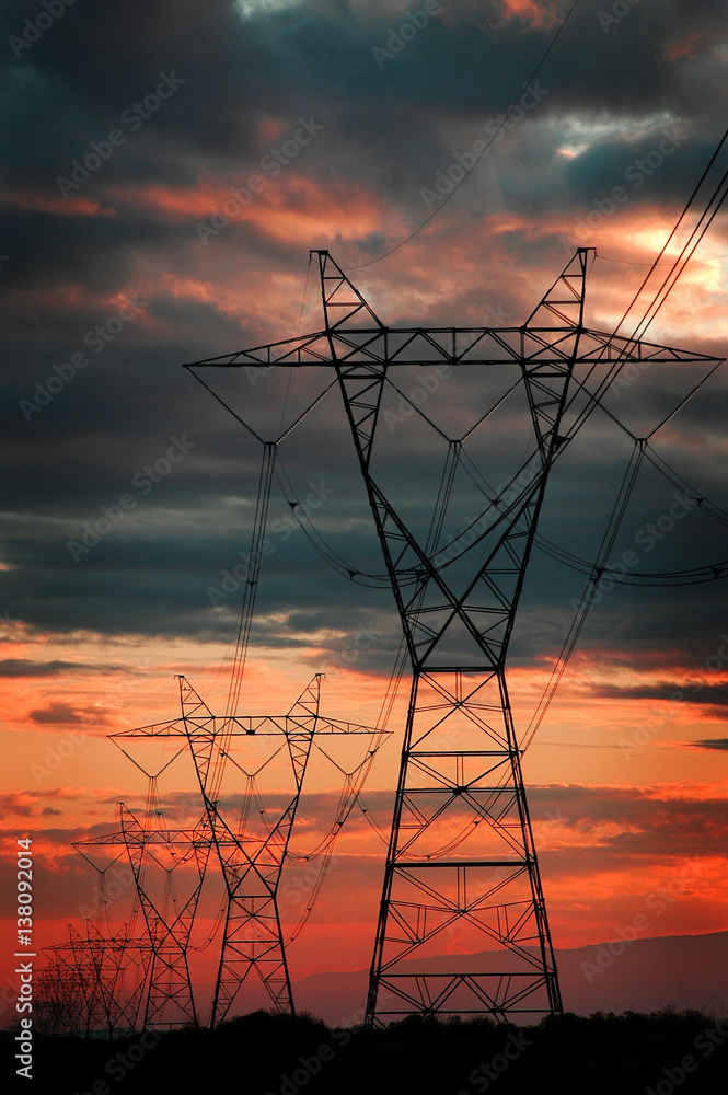 Power Lines for Electricity Metal Towers and Sunset