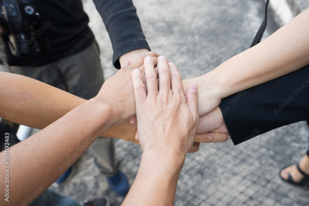 Team work concept. Business people joining hands