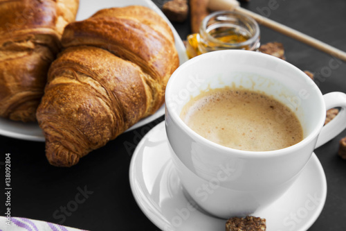 Coffee cup with croissants breakfast meal