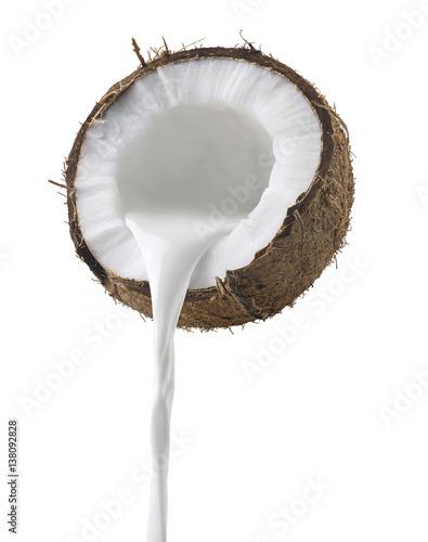 Coconut milk pouring side view isolated on white background