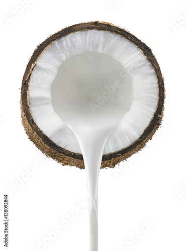 Coconut milk pouring front view isolated on white background