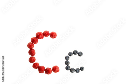 Alphabet from fresh fruit, raspberry and blackberry
