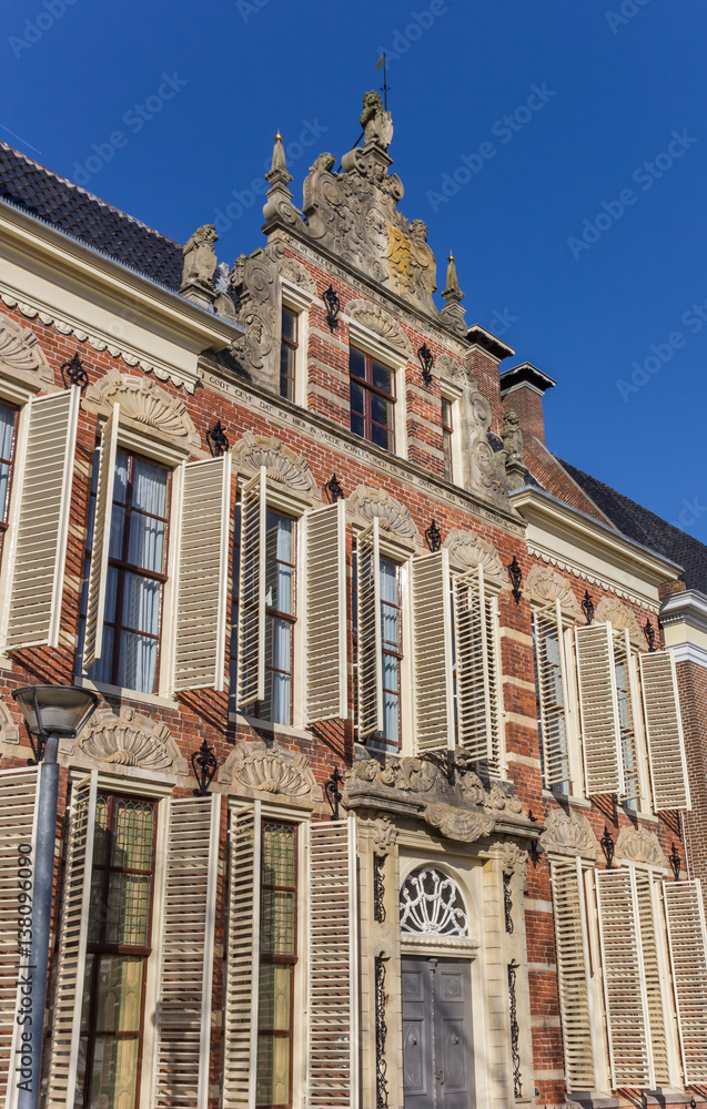 Old decorated facade with blinds in Groningen