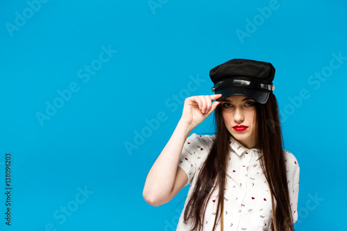 fashion portrait of stylish photographer girl holding vintage retro camera