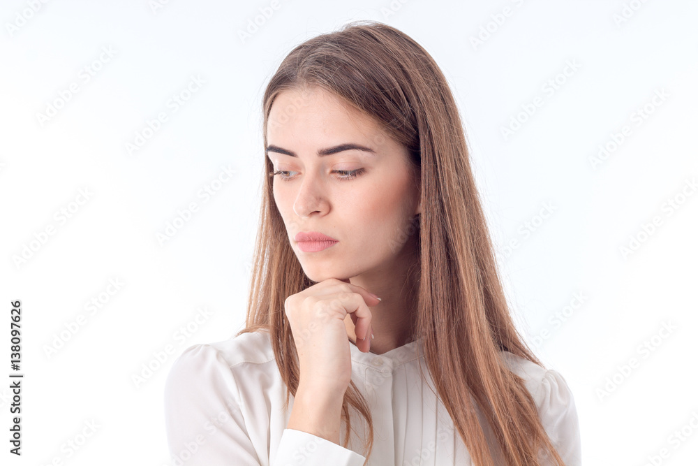 serious thoughtful girl looks down isolated on white background serious thoughtful girl looks down isolated on white background