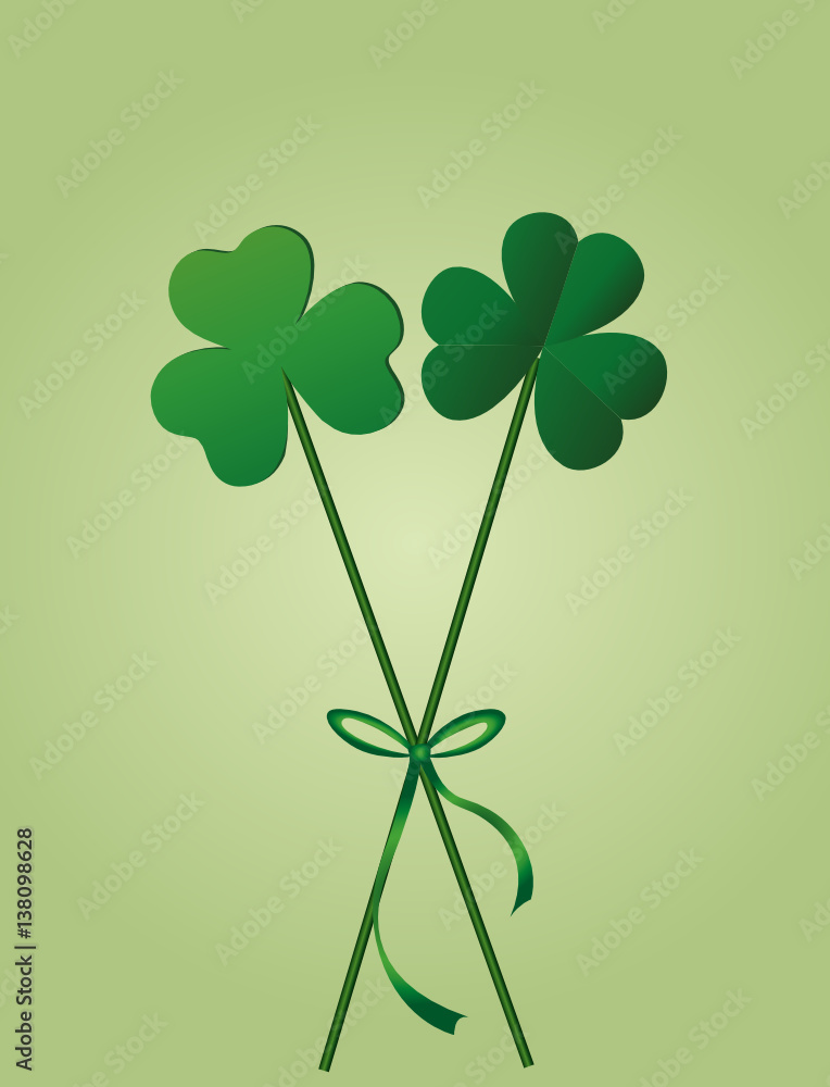 Petals of clover with the image on sticks tied with a ribbon and bow. 