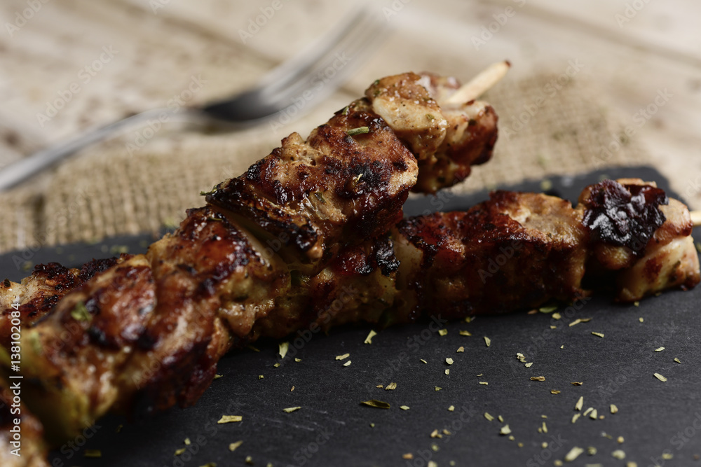 barbecued spiced chicken meat skewers