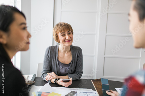 An interior designer consults with clients