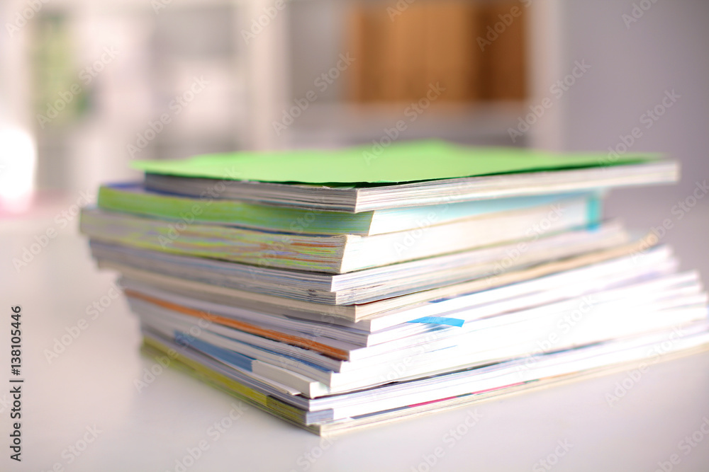 close up of stack of papers on white background close up of stack of papers on white background