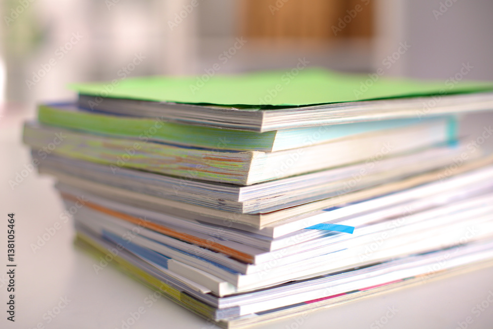 close up of stack of papers on white background close up of stack of papers on white background
