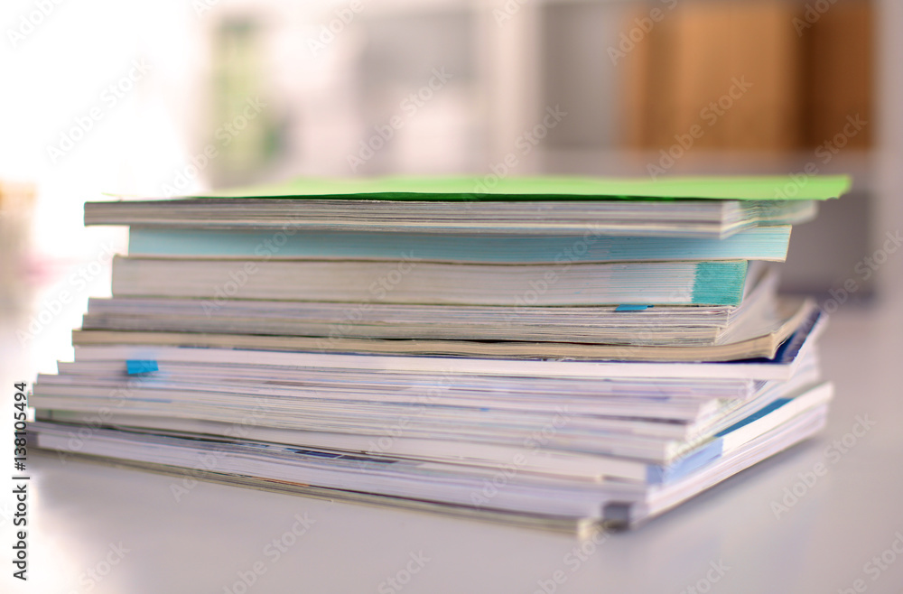 close up of stack of papers on white background close up of stack of papers on white background