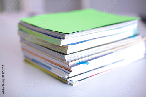 close up of stack of papers on white background © lenetsnikolai
