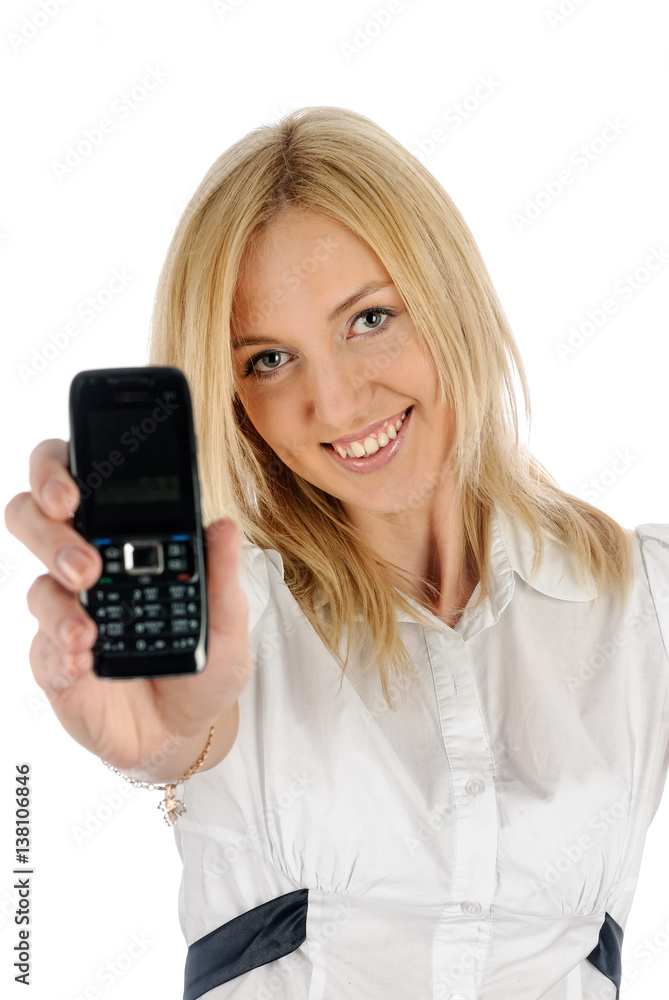 Attractive woman shows her mobile phone. Isolated over white background Attractive woman shows her mobile phone. Isolated over white background