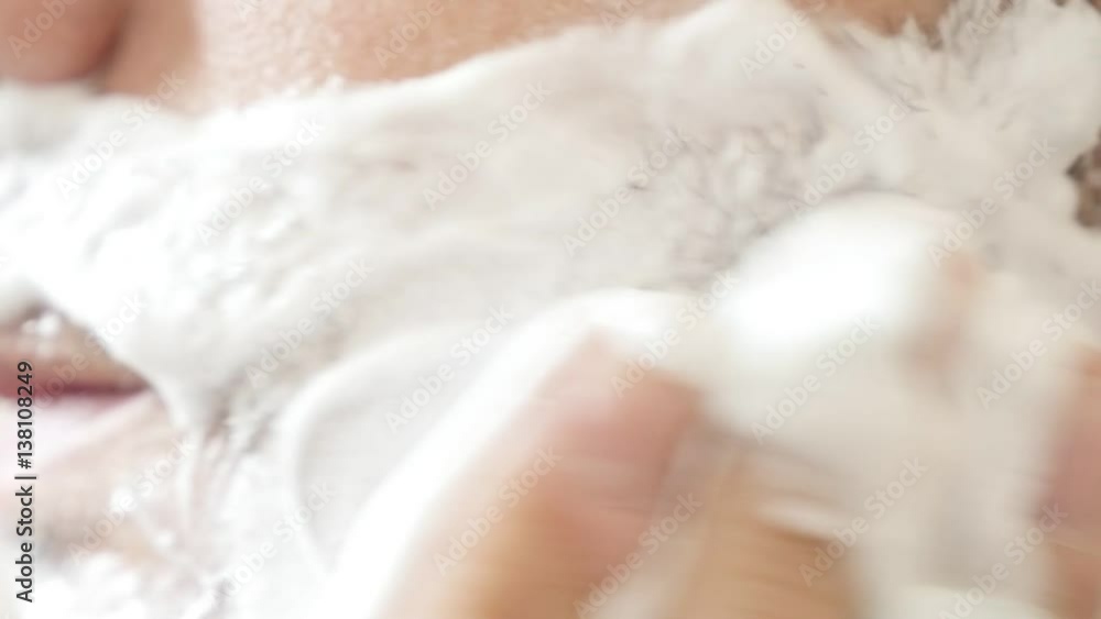 Man with right hand spreads shave gel on beard in slow motion 1920X1080 HD footage - Male face with shaving foam applying 1920X1080 HD video Man with right hand spreads shave gel on beard in slow motion 1920X1080 HD footage - Male face with shaving foam applying 1920X1080 HD video