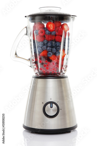 Blender filled with Frozen Berries to make a healty Smoothie