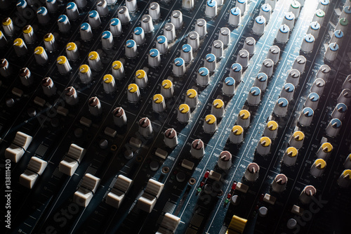 Professional Audio dj mixer console, sound tools and gear, studio equipment picture, selective focus picture of faders and knobs of mixer