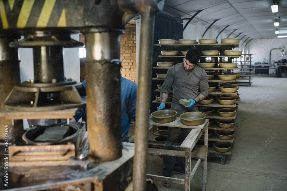 man that works in the factory of pottery man that works in the factory of pottery