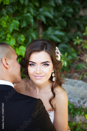 Bride and groom walking around buildings. Wedding day. Holiday clothes © serbogachuk