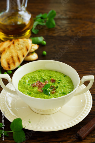 Soup of green peas with bacon and mint.