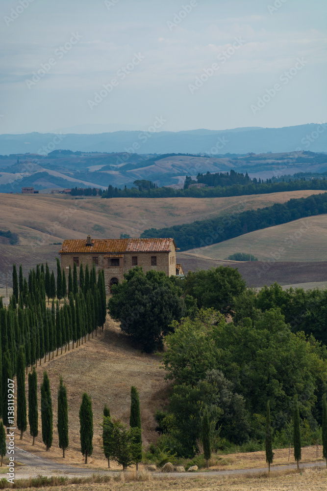 Typical landscape in Tuscany, farmhouse on the hills of Val d'Orcia - Italy