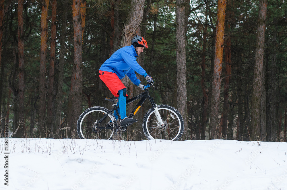 Extreme mountain biking in the snow-covered forest. Extreme mountain biking in the snow-covered forest.