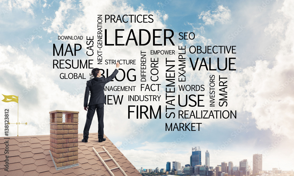 Young businessman standing on house roof and writing leadership Young businessman standing on house roof and writing leadership